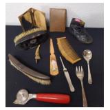 Group of vintage items including brushes, Combs,