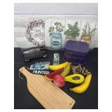 Place mats and fake fruit and light and jewelry