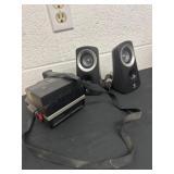 Logitech speaker and Polaroid.  camera