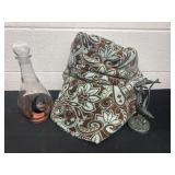 Glass decanter with thrown blanket and dolphin