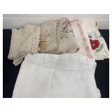 Group of table clothes and dollies