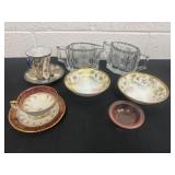 Group of tea cups and saucer, glass cream and