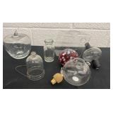 Group of glass bottles and bell and apple