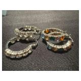 pair of silver-toned hoop earrings with clear and