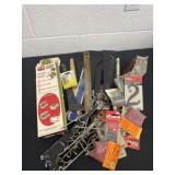 Group of nails and shelf brackets and hooks and