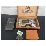 Cigar box full of watches, lighters, wallet