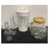 2 glass bottles glass jar and pitcher