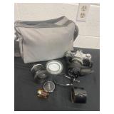 Canon camera with case and lens