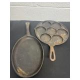 Two 9ï¿½ cast iron skillets.  One says made in USA