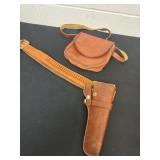 Leather gun holder with pouch.