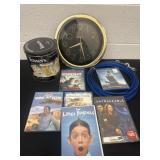 Group of dvds, teasers, clock and dog chain