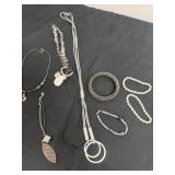 4 necklaces and brackets