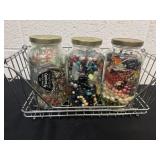 Three 7ï¿½ glass jars of jewelry