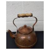 Copper teapot with wooden handle