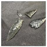 3 arrow heads and a part of one