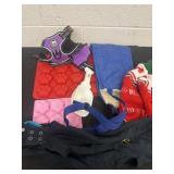Group of dog cloths, molds and harness