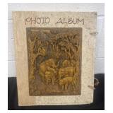 Vintage photo album with carved elephants