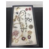 Group of vintage jewelry in display box
