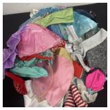 Group of barbie clothes