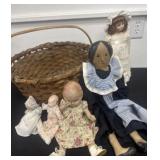 Group of vintage dolls with basket