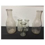 5 vintage glass milk bottles.