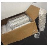 Box of plastic shot glasses macallan