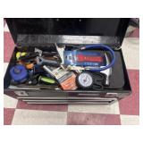 Metal black tool box full of tools