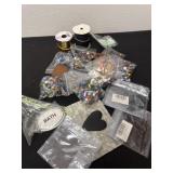 Group of beads and ribbon