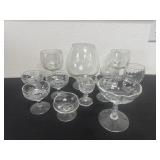 Group of glass wine cups some have chips