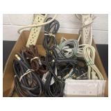 Group of cords and surge protectors.