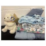 Group of kids blankets and teddyï¿½s bear