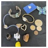Tokens, rings watches bracelets and pins