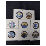 Group of eight colorized state quarters