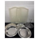 Group of plastic trays and plates with vase