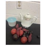 Teapot and fake fruit