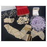 Ring display with necklaces and faux pearl