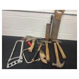Group of hammers, saws and axes