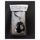 All nickel silver with onyx pendant on silk cord