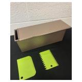 Metal organizer with baking scrapers.