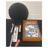 Dominoes and pressure tire gauge tools.