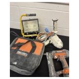 Group of work lights and Ridgid tools