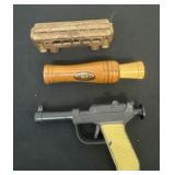 Cast iron train, goose call and knickerbocker gun