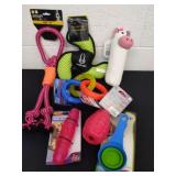 Large group of dog toys and a  clip scoop