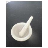 white porcelain mortar and pestle set