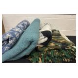 Box of blankets and rug