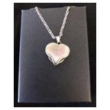 Right edge mother of pearl heart blade necklace.