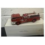 scale die-cast model of a 1960 Mack C Fire