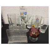 Group of drinking glasses with napkin holder