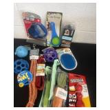 Group of new dog toys and leash and harness
