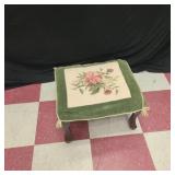 Antique footstool with cross stitch